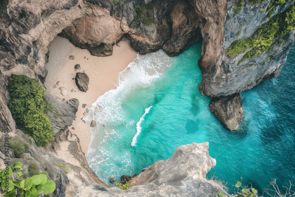 Stunning top-down view of a hidden beach surrounded by rugged cliffs and lush greenery Stunning top-down view of a hidden beach surrounded by rugged cliffs and lush greenery