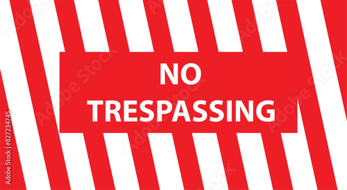 No trespassing sing hanged on an wire fence in front of a dockyard. It says that passing from here is forbidden.