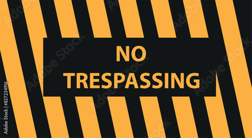 No trespassing sing hanged on an wire fence in front of a dockyard. It says that passing from here is forbidden.