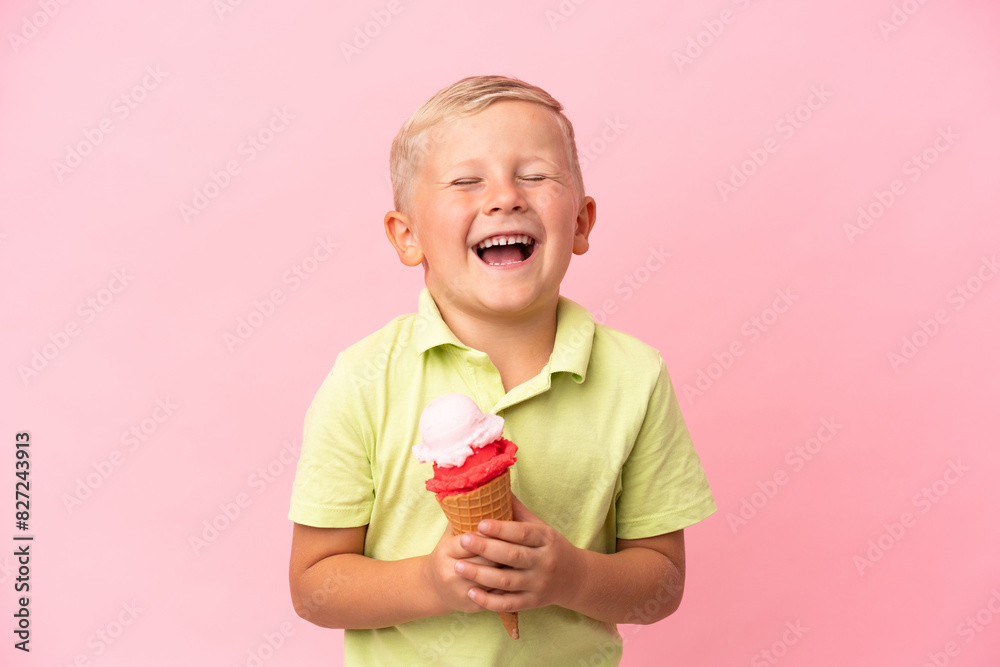 Little Russian boy with a cornet ice cream over isolated background