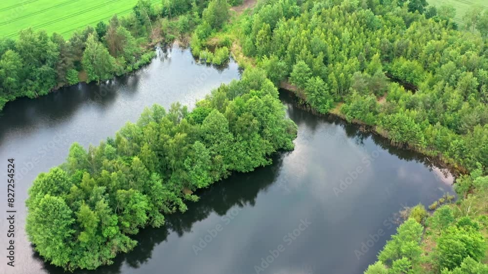 Aerial View of a Flooded Quarry Lake with a Densely Wooded Island Aerial View of a Flooded Quarry Lake with a Densely Wooded Island