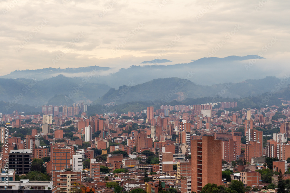 Beautiful panorama (cityscape) of Medellin, Medellín. The pictures shows condominiums and the Andes Mountains. Antioquia, Colombia. Orange evening sky.