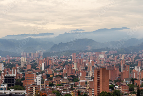 Beautiful panorama  cityscape  of Medellin  Medell  n. The pictures shows condominiums and the Andes Mountains. Antioquia  Colombia. Orange evening sky.