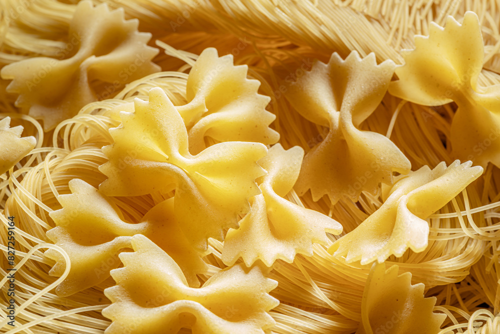 Italian pasta farfalle and vermicelli close-up. Food background. Italian pasta farfalle and vermicelli close-up. Food background.