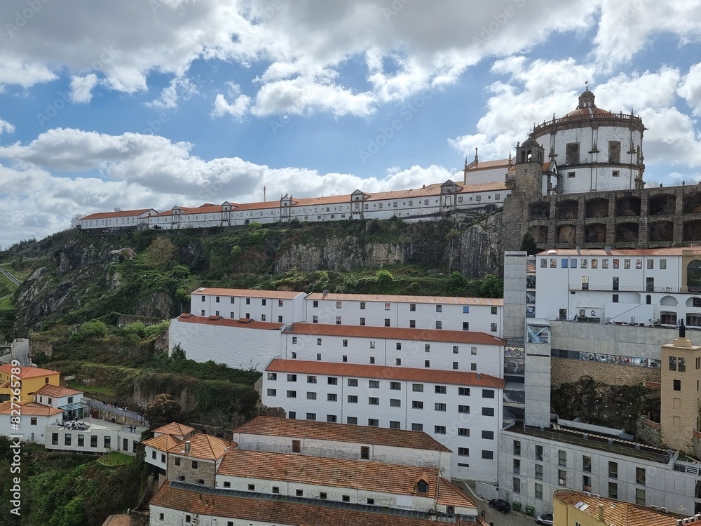 Obraz premium Porto, Portugal, typical architecture in the city center with white houses and red roofs, green nature near the buildings