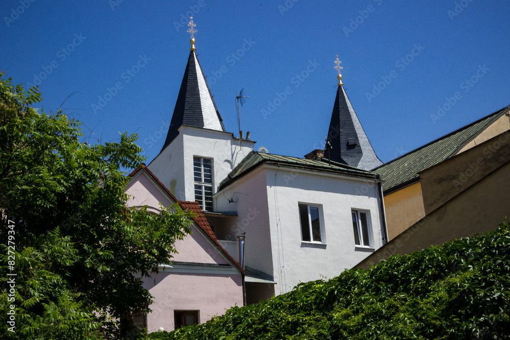 the roof of a house with turret decorations, decorative elements, windows, architecture of a small town the roof of a house with turret decorations, decorative elements, windows, architecture of a small town