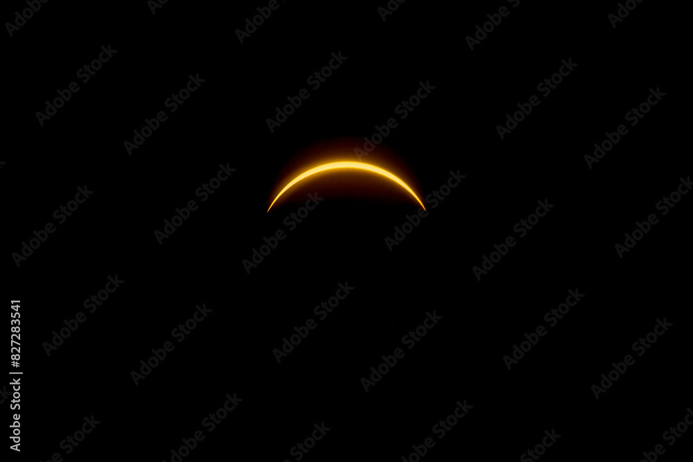 Solar eclipse featuring a diamond ring effect and baileys beads