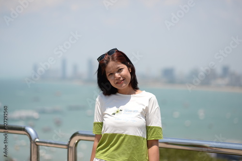 Smiling woman enjoying a sunny day at the beach