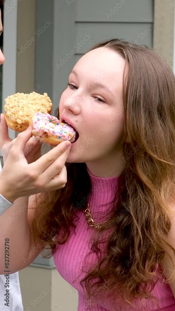 The guy treats his beloved with a delicious donut. A guy and a girl are resting. High quality 4k footage The guy treats his beloved with a delicious donut. A guy and a girl are resting. High quality 4k footage