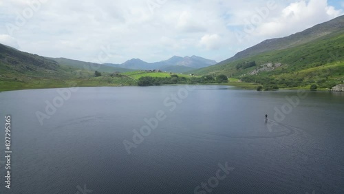 Ascending drone shot of Llynnau Mymbyr lakes in Dyffryn Mymbyr valley near Capel Curig, Wales, UK photo
