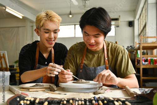 An artist teaches a student the art of pottery, guiding hands-on techniques in a creative studio. The collaborative spirit of art education, emphasizing skill development and mentorship