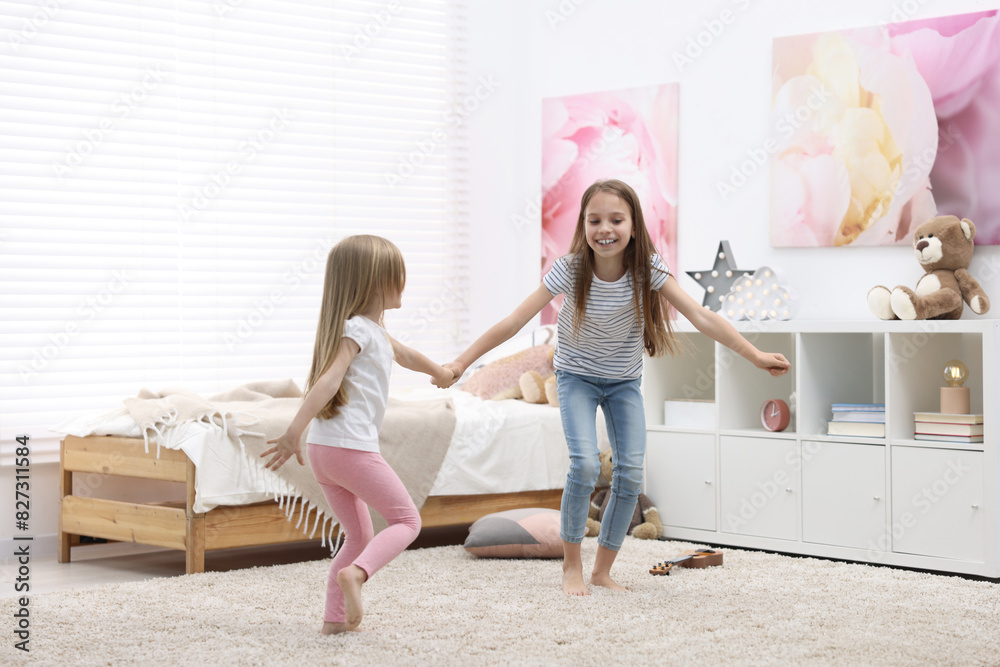 © New Africa - Cute little sisters having fun together at home © New Africa - Cute little sisters having fun together at home