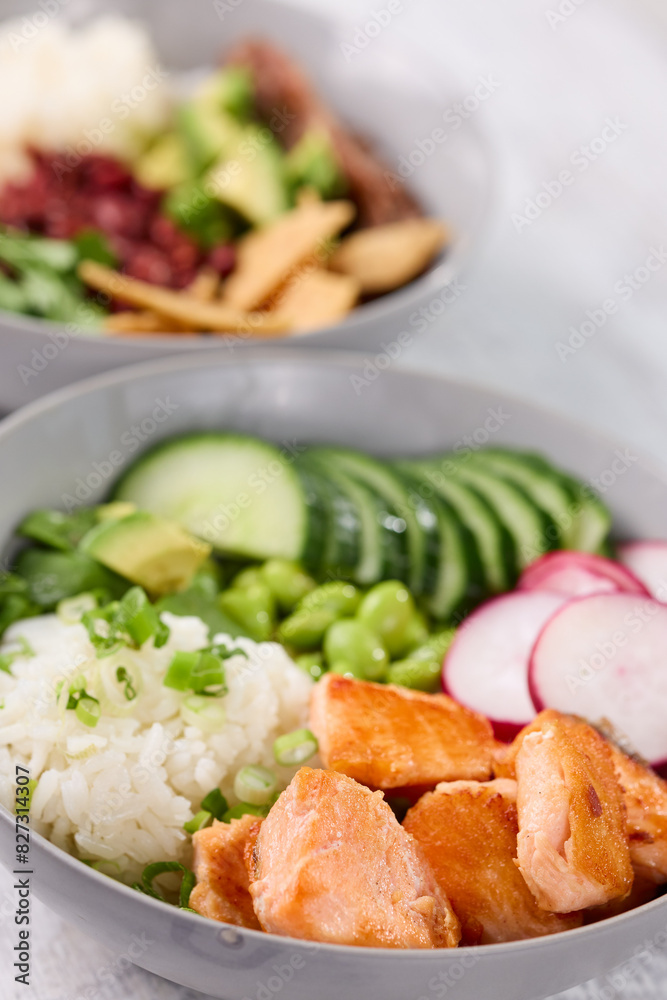 Bowls of food and utensils on a table in a simple setting Bowls of food and utensils on a table in a simple setting