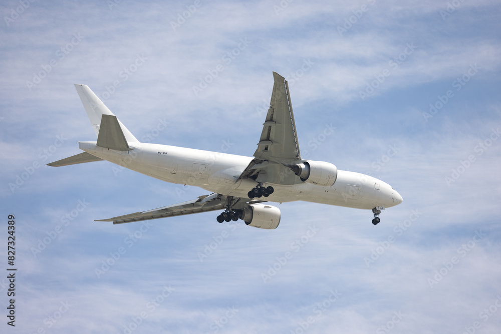 Airplane flying against a blue sky. Airplane flying against a blue sky.
