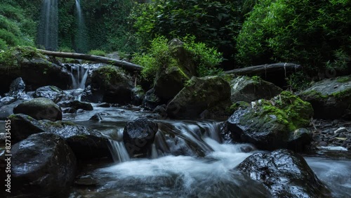 timelapse the beauty of the twin grenjengan waterfalls in the morning. The twin grenjengan waterfalls are located in Pakis District, Magelang, Central Java. photo