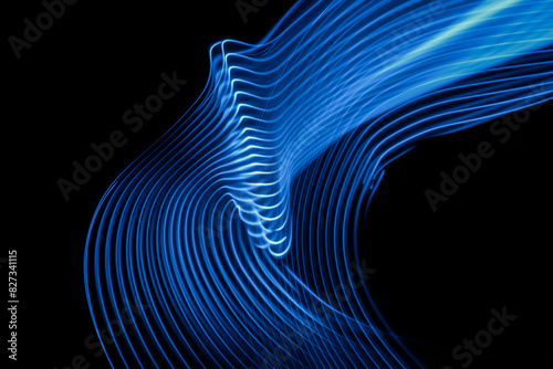 Abstract technology background of long exposure neon light stripes on black. High quality photo