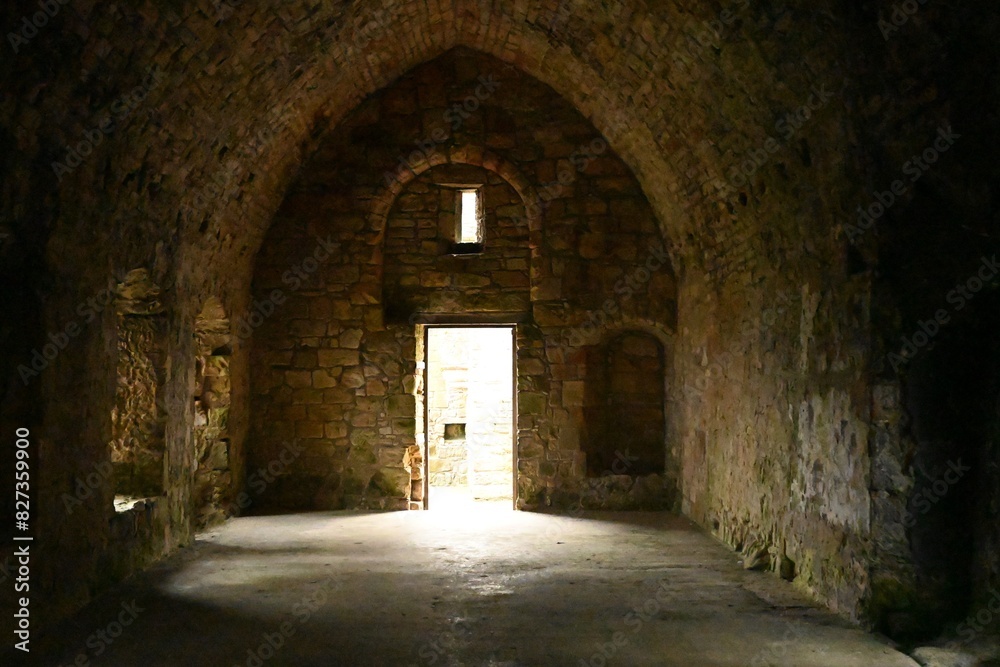 Large open room with a spacious doorway emitting light Large open room with a spacious doorway emitting light