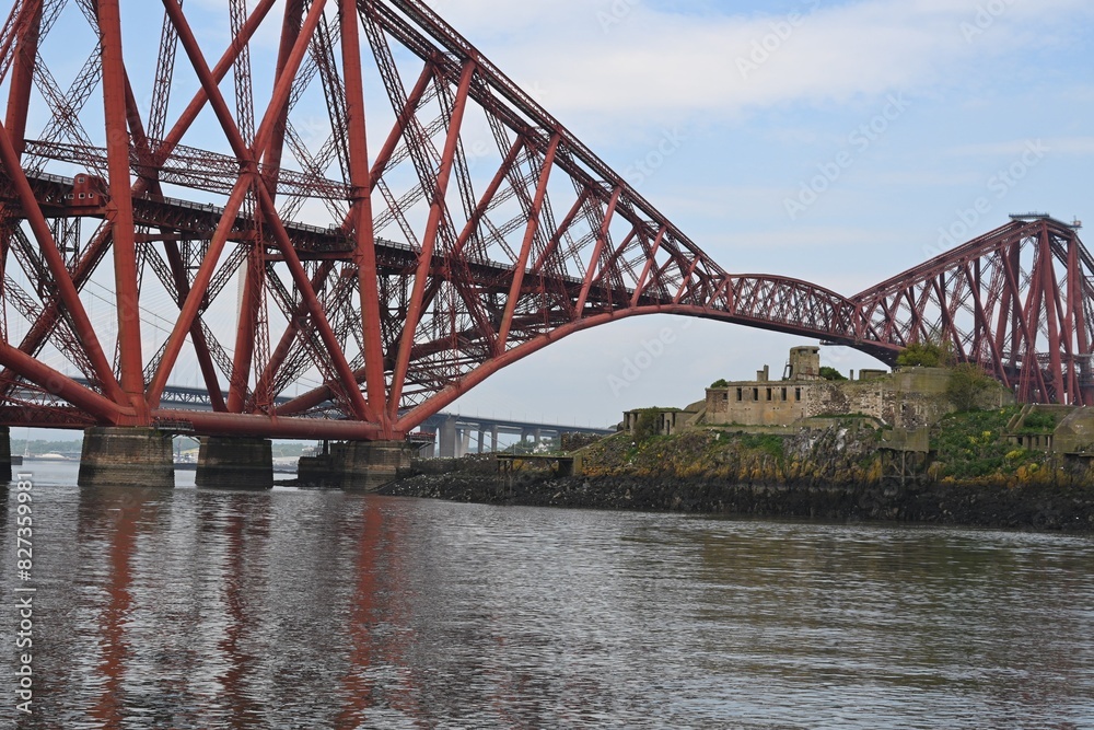 Train bridge over river by castle and island Train bridge over river by castle and island