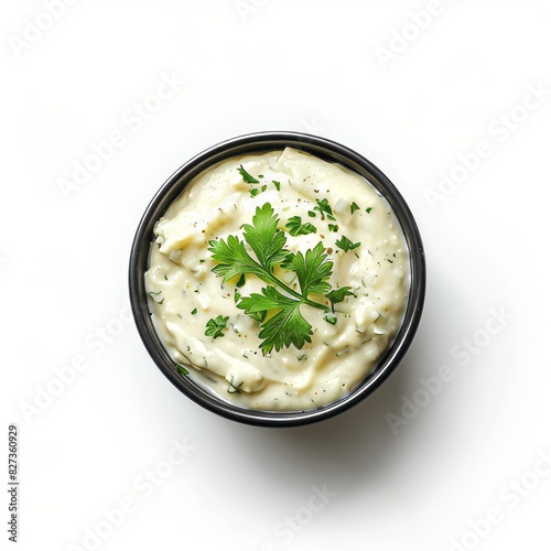 A Bowl of Creamy sauce With a Sprinkle of Fresh Parsley