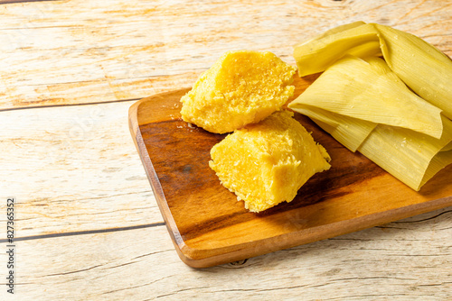 Fotografie Traditional Brazilian pamonha served on a rustic wooden board