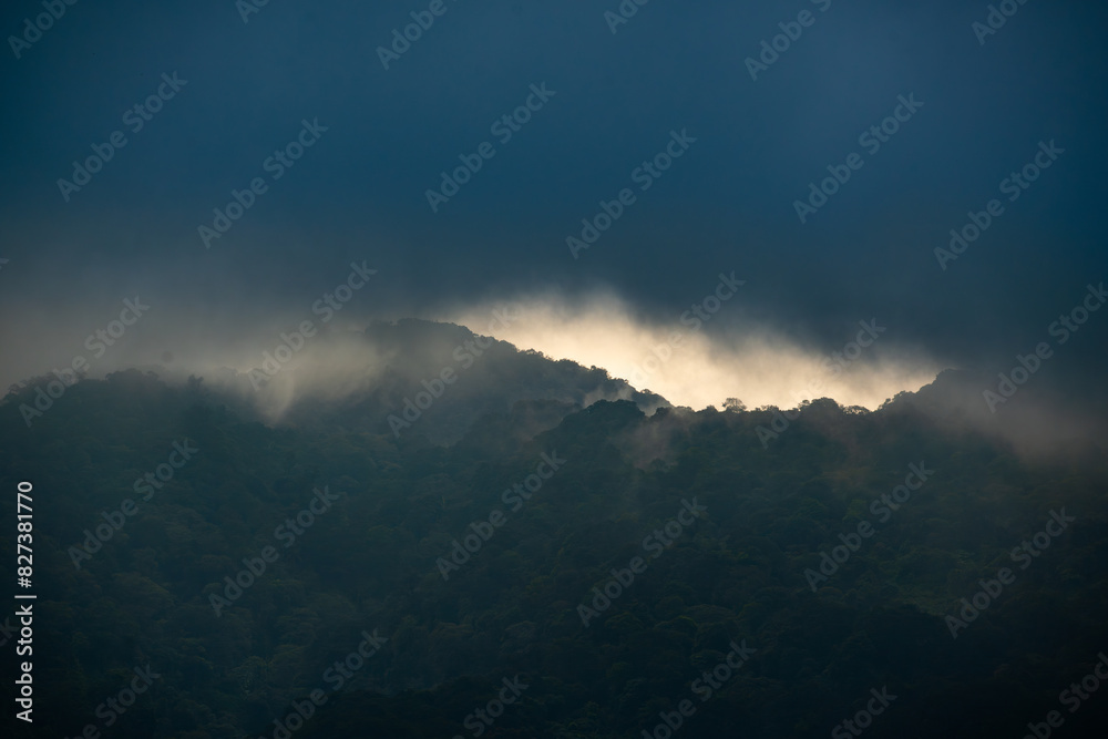 cloudy sunset over salak mountain, gunung salak, with dark color mood