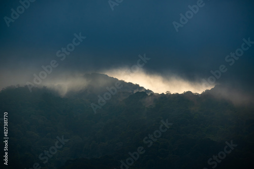 cloudy sunset over salak mountain, gunung salak, with dark color mood photo