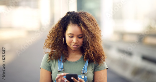 Woman, road and browsing internet on smartphone for social media, communication and networking. Female person, smile and satisfied in city with mobile app and texting with chatting in Brazil photo