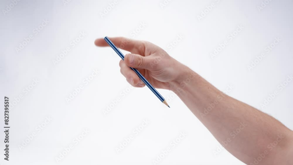 A caucasian male hand stimming and fidgeting quickly with a pencil, suggesting ADHD, autism, nervousness, or anxiety. Captured isolated against a plain white background. 