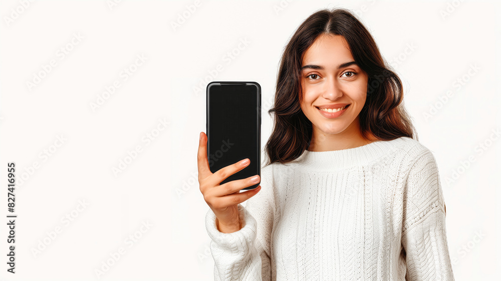 A lovely woman displays a smartphone mockup featuring a blank screen A lovely woman displays a smartphone mockup featuring a blank screen