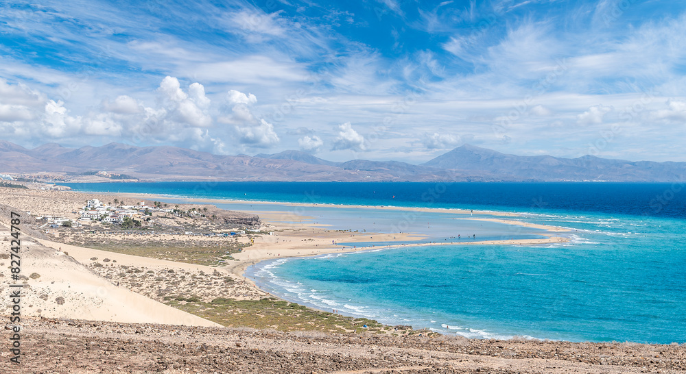 Playa de Sotavento, Fuerteventura: a breathtaking aerial view of crystal-clear lagoons and sweeping sand dunes on this iconic Canary beach.