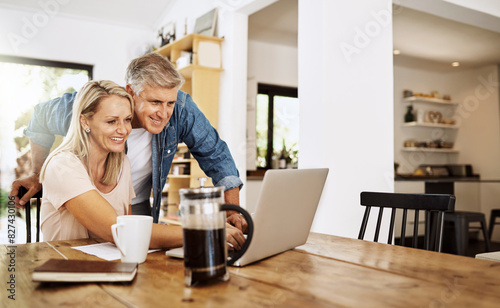 Mature, couple and retirement research on laptop planning finance, real estate or reading news online. Banking, investment and people with talking of asset management in home with document or review