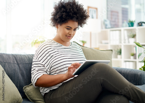 Sofa, tablet and black woman in office with reading notes, entrepreneur and virtual consultation. Telehealth, tech and African female psychologist on couch for mental health with counselling advice