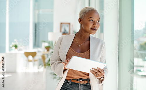 Black woman, business and office with tablet for thinking, website developer with plan in workplace. Female coder, ebook and happy with research or idea for online app, network project for digital