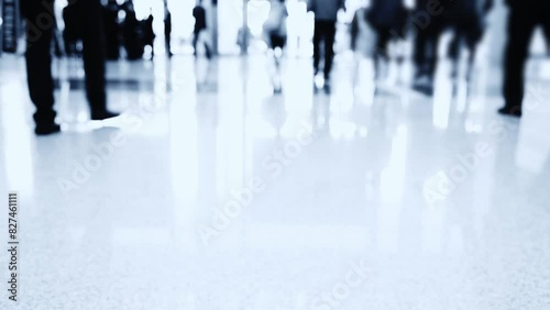 Large group of people walking in exhibition hall