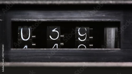 Old mechanical counter counts numbers from 0 to 2350, macro shot 4k photo