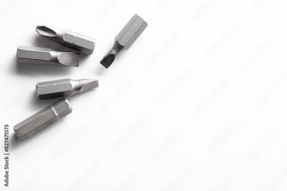Different screwdriver bits on white background, top view Different screwdriver bits on white background, top view