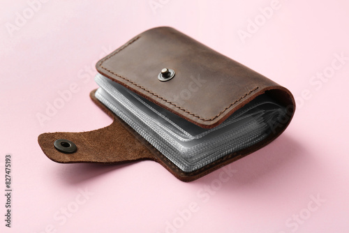 New leather card holder on pink background