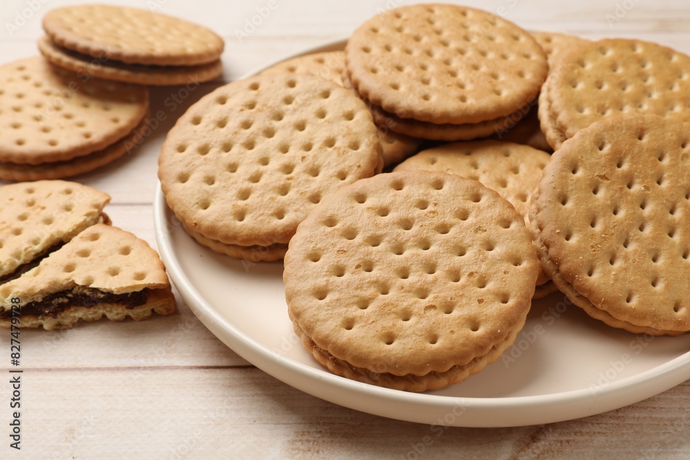 Fresh tasty sandwich cookies on wooden table, closeup