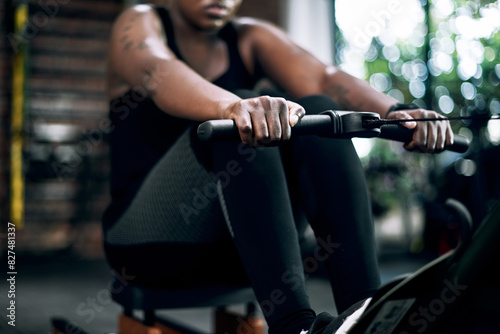 Black woman, row machine and hands for fitness, training and gym for sports workout. Exercise, bodybuilder and cardio for body health and wellness, active and challenge for African person in studio