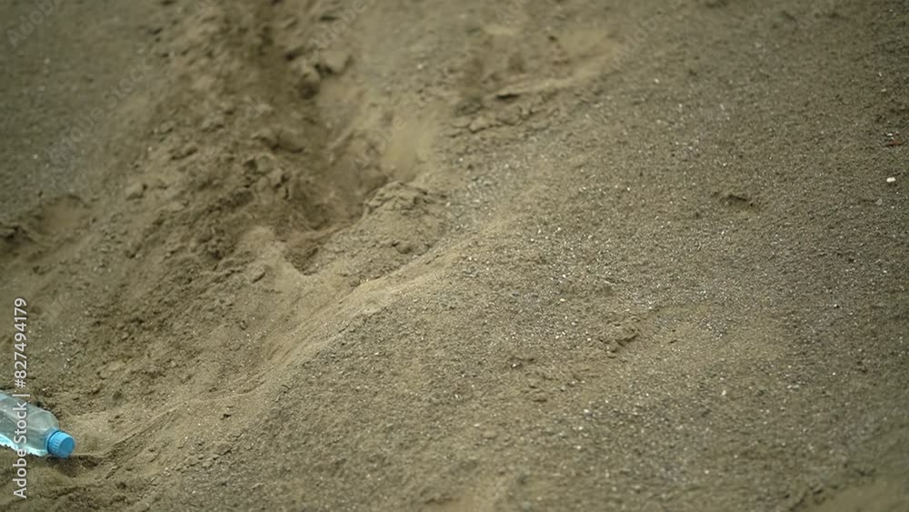 man in the desert. plastic bottle. plastic bottle and sand. High-quality shooting in 4K format. man in the desert. plastic bottle. plastic bottle and sand. High-quality shooting in 4K format.