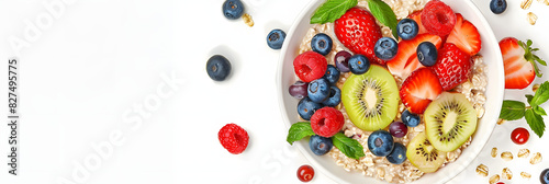 Healthy oatmeal served with berries and fresh fruits on white background. Healthy breakfast. Top view