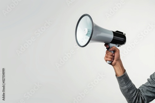 Close-up of a megaphone held by a person against white background, copy space. 