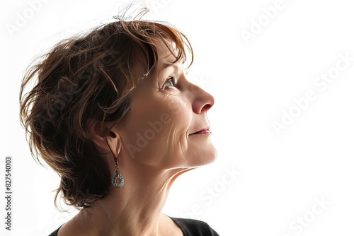 Woman in relaxed pose looking upwards, expressing contemplation and serenity