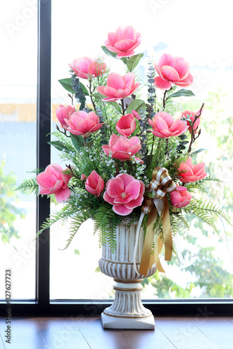 Flowers in a vase by the window