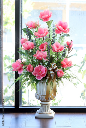 Flowers in a vase by the window