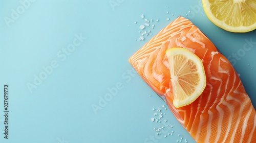 A fresh salmon steak with lemon and orange slices rests on a blue background