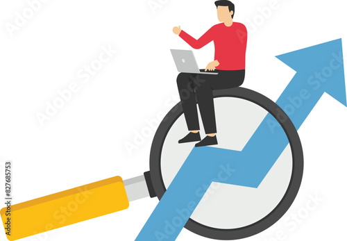 Concept of economic growth with chart and magnifying glass

