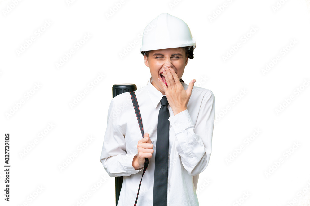 Young architect woman with helmet and holding blueprints over isolated background happy and smiling covering mouth with hand Young architect woman with helmet and holding blueprints over isolated background happy and smiling covering mouth with hand