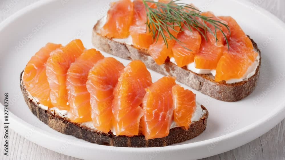 Rye sandwich with salmon and cream cheese on white wooden table Rye sandwich with salmon and cream cheese on white wooden table