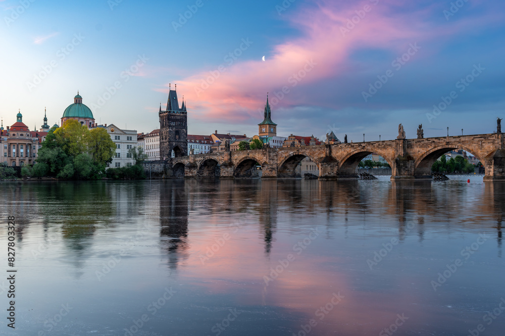 Colorful sunrise over Charles Bridge (Karluv Most) over Vltava River in Prague, Czech Republic